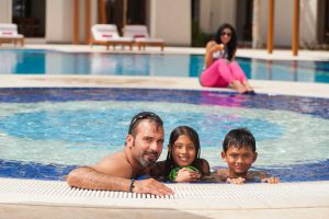 Family enjoying the pool at Sifawy Hotel