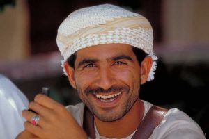Omani man smiling at Sifawy Hotel Jebel Sifah